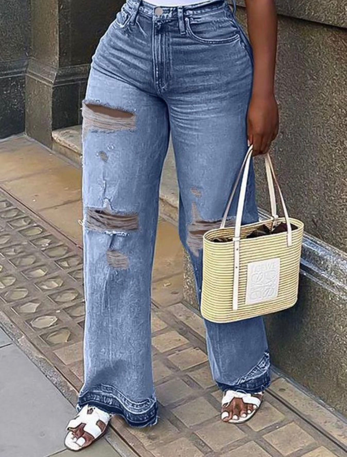 Women’s ripped blue denim jeans