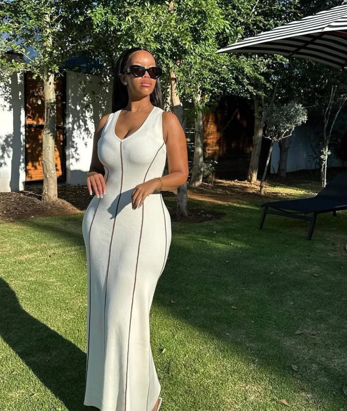 Women’s white horizontal sleeveless long open chest dress