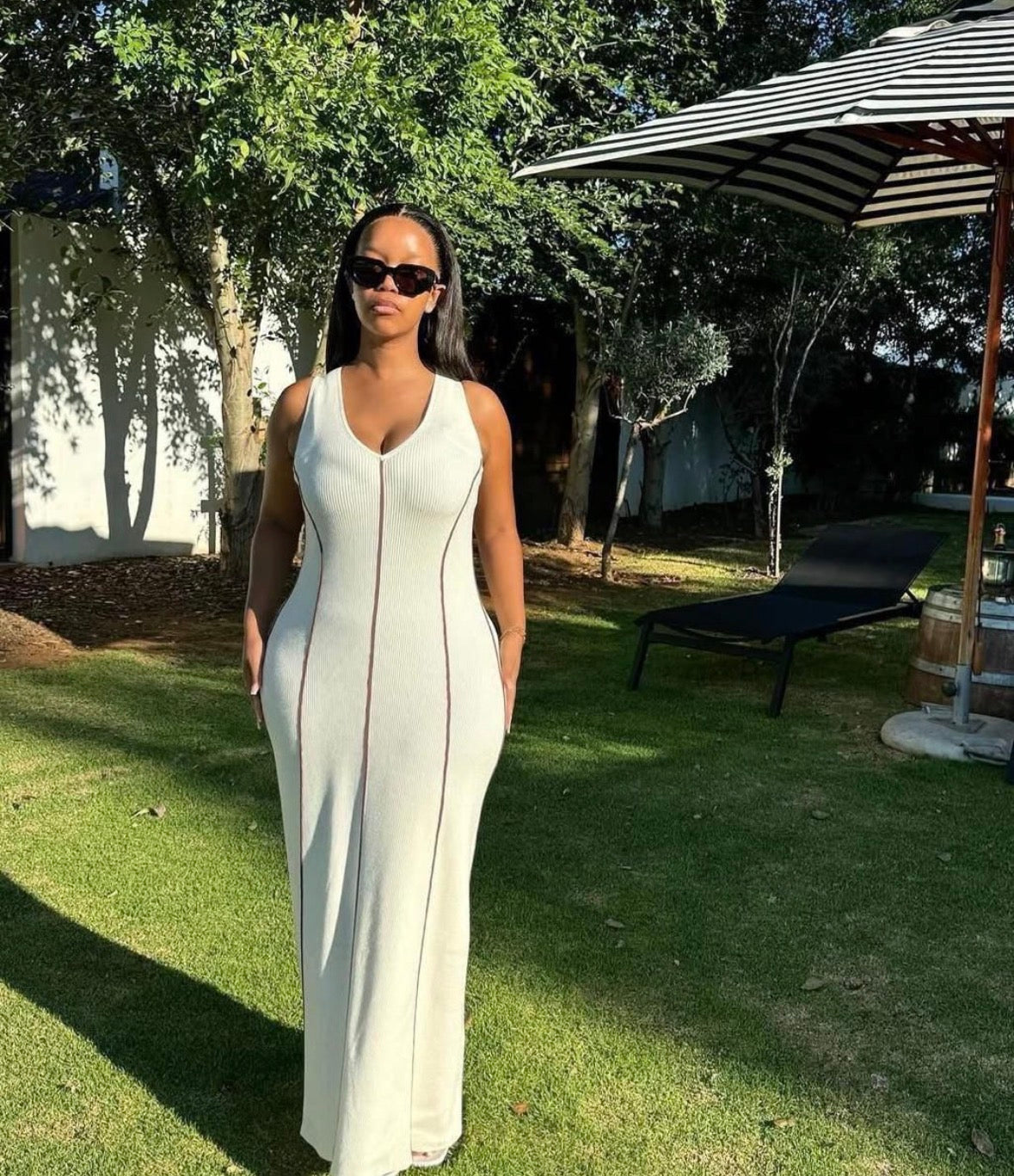 Women’s white horizontal sleeveless long open chest dress