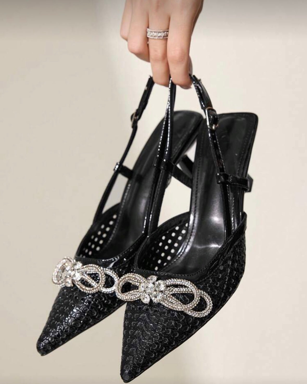 Women’s rhinestone decor now and solid colour black sling back