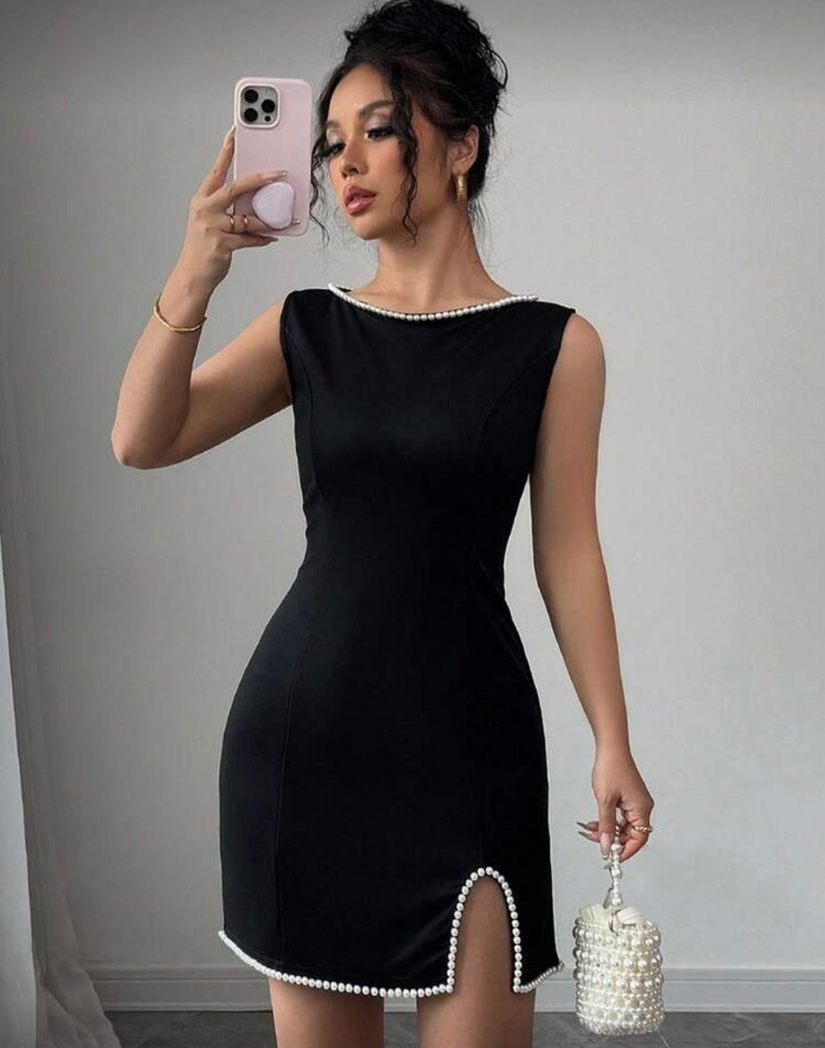 Women’s black solid colour design pearl bottom and neck line dress